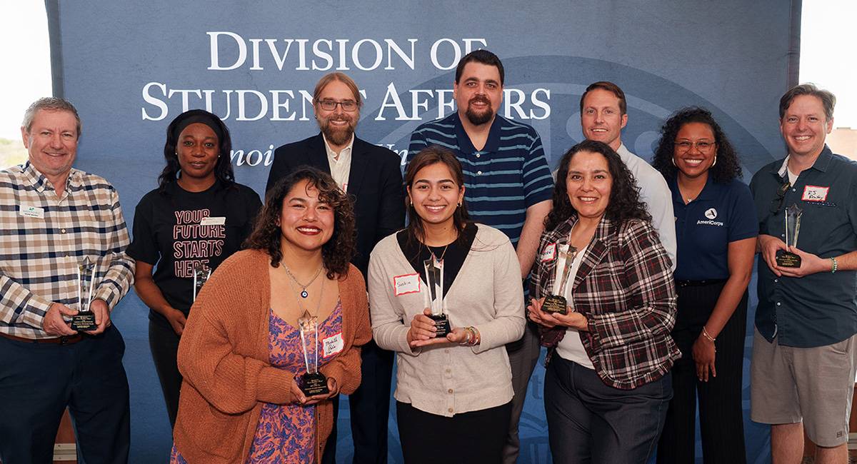 group photo of the 2026 Commitment to Career Excellence Award winners with their trophies
