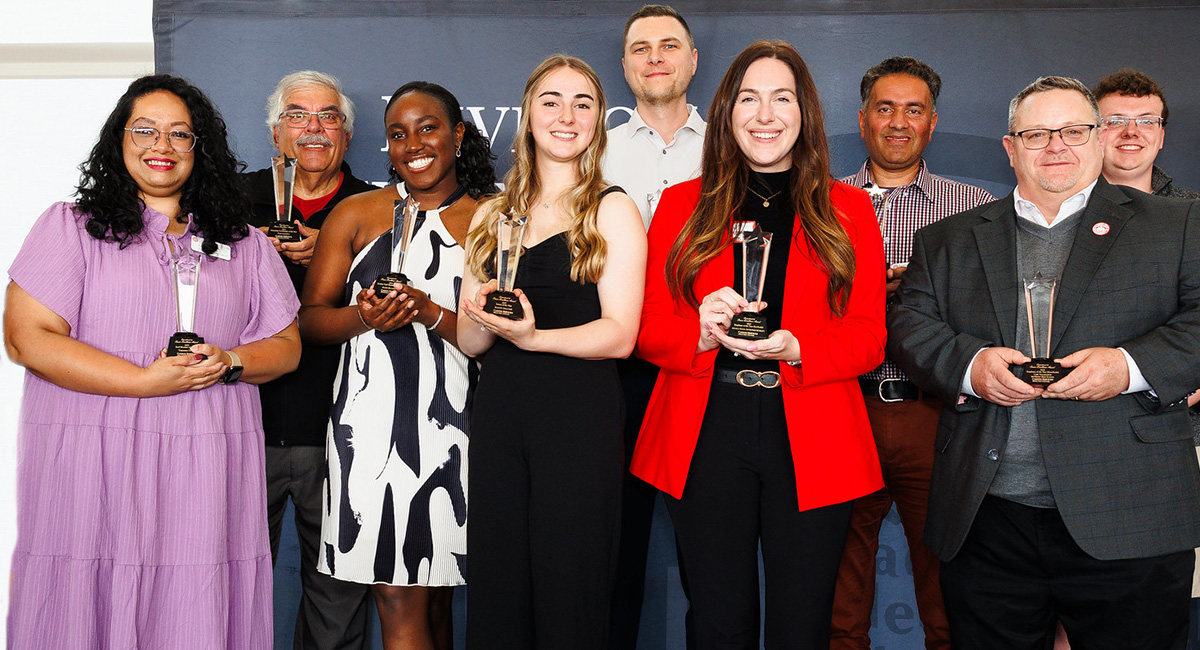 photo of recipients holding awards
